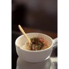 A modern take on a classic street food. My Molecular Dahi Wada offers the familiar tangy and sweet flavors of dahi wada in a unique, bite-sized form.