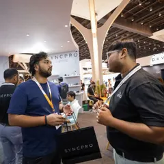 One of our team members in a deep discussion with a visitor at our Smart Home Expo booth. We value these conversations to understand the real-world challenges our clients face.