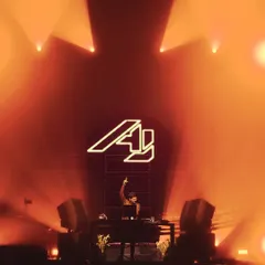 My logo lit up on the big screen at the Dome. This was a massive production and a milestone performance in my career.