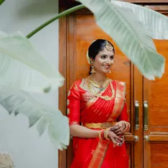 A smiling shot of Rishika. The makeup is designed to look fresh and natural in daylight.