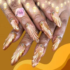 Golden glam with a touch of royalty. A closer look at the stunning 3D golden wing design, featuring a metallic chrome finish and jewel accents.