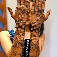 A lovely design featuring the couple's initials, 'K' and 'H', on the back of the hands, along with a personal mantra written in Hindi.