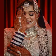 A bride's shy smile holds so much emotion. This close-up portrait from a Muslim wedding focuses on the intricate details of her jewelry and the delicate expression just before the main event. My goal is to capture that quiet beauty.