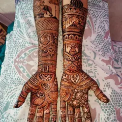 I love bringing a bride's story to life. This custom bridal design features traditional motifs like elephants and a palanquin scene, making the henna deeply personal and unique to her wedding story.