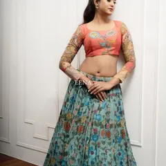Discover the beauty of traditional craftsmanship with this stunning Pen Kalamkari lehenga. The piece is meticulously hand-painted by my artisans, with a story unfolding on the blouse sleeves and a beautiful floral pattern on the skirt and dupatta.