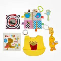 This is a catalogue-style flatlay of baby products, neatly arranged on a clean white background. This format is perfect for e-commerce sites, allowing brands to display multiple items clearly.