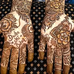 Making the groom's sister feel special with this "Dulhe Ki Behen" mehendi. It's a fun way to celebrate family at a wedding.
