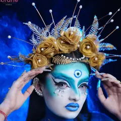 This powerful pose highlights the custom-made golden headpiece and the detailed line work in this blue celestial goddess look.