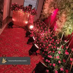 This shot shows how I arrange spotlights within a large floor-level floral installation. This technique adds depth and makes the flower arrangements glow from within.