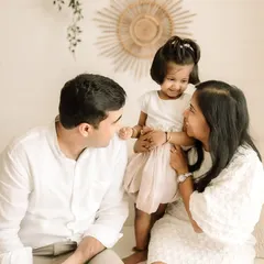 A candid moment of interaction between parents and their little girl. I love capturing these unscripted looks of love.