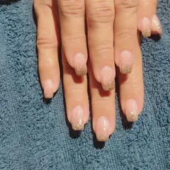 Another look at the nude and gold glitter French manicure, showing the sparkle under different light.