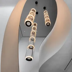 The sculptural, winding staircase in our Worli Duplex project is a central anchor that breaks the home's orthogonal geometry. We designed it not just for circulation, but as a defining artistic element, with its soft curves framing a cascade of modern lighting.