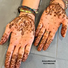 A finished view of the minimal design from the video, showing how beautiful and complete a lighter mehendi can look on both hands.