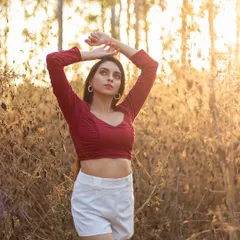 There is nothing like the magic of golden hour. We ventured into a wooded area to catch the last rays of sun, creating this warm and dreamy portrait that feels both natural and cinematic.