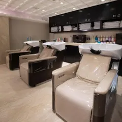 The hair wash is a moment of pure relaxation. Our ergonomic wash stations and professional-grade conditioning treatments are the first step in preparing your hair for its transformation.