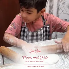 This little chef is seriously focused on rolling out his pizza dough. My Mom and Kids workshops give children a real, hands-on cooking experience.