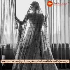 A bride, seen through her veil, looks out a window in a moment of quiet reflection before her wedding. We are here to support our clients through all the emotions of the wedding journey.