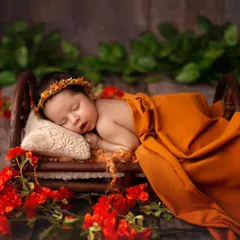 Dreaming sweetly in a miniature wooden bed. This prop is a client favorite and allows for beautiful, classic poses that look so angelic.