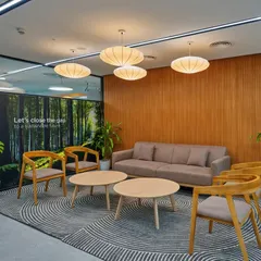 First impressions matter. We designed this corporate reception area with natural wood furniture, contemporary pendant lighting, and a soothing color palette to create a calm and professional atmosphere for visitors and employees.