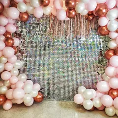 Here is a trendy and fun 'Bride to be' decoration I put together for a bridal shower. The shimmering sequin wall provides a glamorous photo backdrop, framed by a custom balloon arrangement in pink, white, and rose gold.