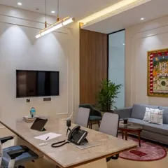 This cabin is designed for both individual work and small team meetings. The main desk is large enough for collaboration, and a separate sofa area provides a more relaxed setting for discussions.