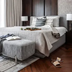 This bedroom strikes a balance between sleek sophistication and bold youthfulness. Dark wood paneling adds depth, while shades of grey and pinstripes provide a modern, tailored feel. The overall aesthetic remains minimalist and effortlessly stylish.