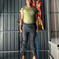 Demonstrating the strength required for aerial yoga. Here, I'm holding my body weight up using the straps, a foundational exercise for building the necessary upper body and grip strength.