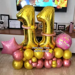An 11th birthday number bouquet in pink and gold.
