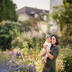 The bond between a mother and her child is so pure. This portrait, set in a lovely garden, captures that connection in a beautiful, natural environment.