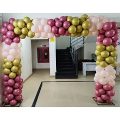 This elegant balloon arch uses a sophisticated color palette of chrome gold, metallic pink, and pastel pink. It's perfect for creating a more upscale and stylish entrance for a corporate event or party.