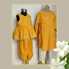 A perfect brother-sister twinning moment in our yellow brocade set. The girl's peplum top with dhoti pants complements the boy's classic angrakha-style kurta.