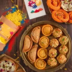 For Holi, I love creating spreads that are as colorful as the festival itself. This platter features an assortment of traditional Indian sweets, including handmade gujiyas, laddoos, and jalebis, all arranged with organic gulal for a truly festive feel.