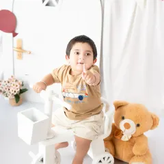 Capturing a toddler's playful side as he points with excitement. These interactive sessions are designed to bring out your child's natural personality.