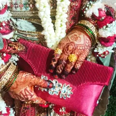 A stunning dark henna stain on my lovely bride, perfectly complementing her red and gold engagement outfit.
