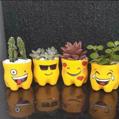 Say it with emojis. This set of four planters is made from upcycled bottles and painted with fun emoji faces, perfect for holding small cacti and succulents.