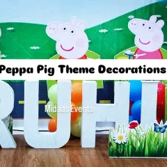 A close-up of the Peppa Pig setup, showing the detail on the cutouts and the large "RUHI" letters. These elements are perfect for photos and make the birthday child feel truly special.