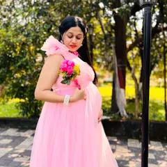 Celebrate your special journey with a beautiful maternity photoshoot. I have gorgeous flowing gowns like this pink tulle one, with rentals starting at just ₹999.