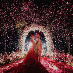 This is the moment it all leads to. We orchestrate these epic, fairytale frames, like this stunning floral shower, to create a memory that feels as grand and magical as the love it celebrates. A perfect shot for a perfect wedding day.