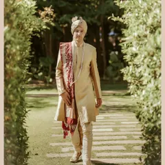 A groom's confident stride towards his future. This shot of William in his elegant sherwani captures a sense of purpose and classic style.