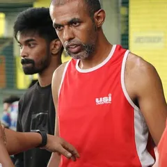 Giving some last minute advice to one of our fighters during a boxing event. Coaching is about strategy and keeping a cool head under pressure.