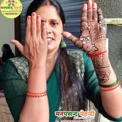 A happy client showcasing her beautiful full-hand design. Her smile is a testament to the quality of our work and service.