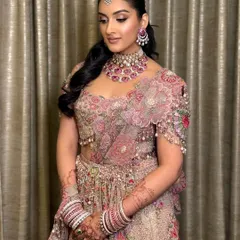 A full view of Mehak's stunning reception look. The soft glam makeup perfectly complements her intricately embroidered lehenga, creating a look of timeless elegance.