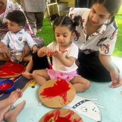 Celebrating the International Day of Play with what we love most: getting creative with paint. This child is fully engaged in the process, exploring color and texture.