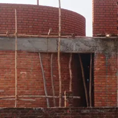 The details of the exposed brickwork at Ashadeep School were a labor of love, especially for a long-distance project in a remote village. The curved walls and patterned brick screens were designed to create a sense of warmth and texture.