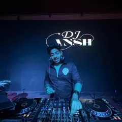 A full view of me at the DJ booth, hands on the decks. I take pride in my setup and ensuring the technical side of my performance is as solid as the music.