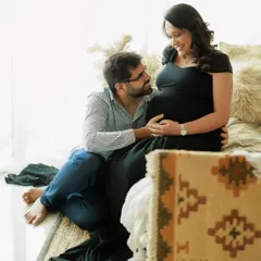 A candid moment during a cozy studio session set up to feel like home. The way he looks at her with so much love and admiration is what makes this portrait so precious.