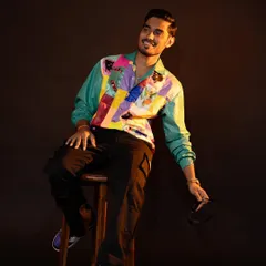It was so much fun styling YouTuber Amit Sharma. This look features a vibrant, retro-style patchwork jacket that perfectly matches his energetic personality, making it great for on-camera appearances.