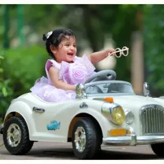 Let's go for a ride! Our outdoor sessions with fun props like this vintage toy car are perfect for capturing your child's laughter and adventurous spirit in beautiful, natural light.