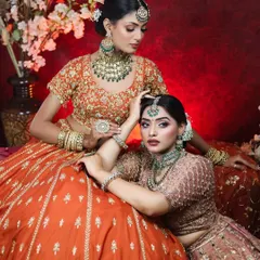 This photoshoot showcases two distinct but complementary bridal makeup looks. I used earthy tones and emerald green accents to create a cohesive and luxurious aesthetic, perfect for a high-fashion bridal editorial or for sisters getting ready together.