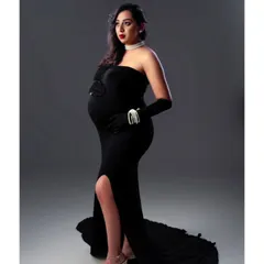 For this stunning maternity shoot, we went for a classic Hollywood glamour theme. I created a bold look with a striking red lip and defined eyes to complement the elegant black strapless gown, ensuring the mom-to-be felt absolutely radiant.